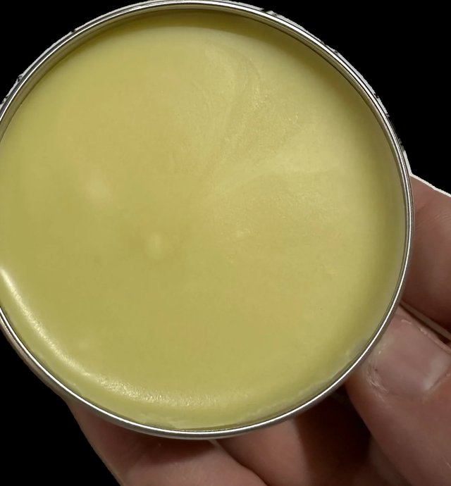 An open tin of F-Balm tallow balm